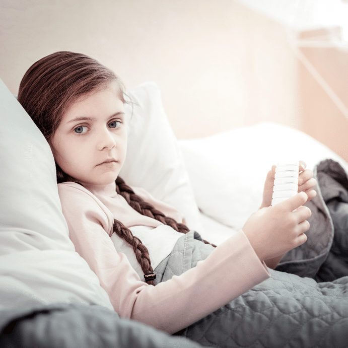 a girl in hospital bed