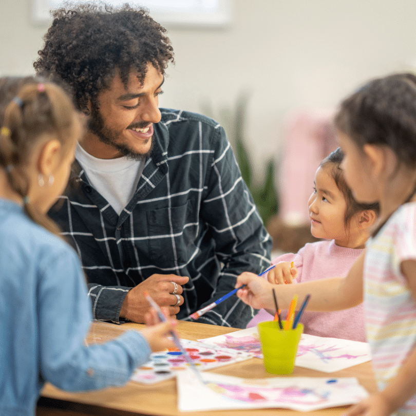 teacher talking to children